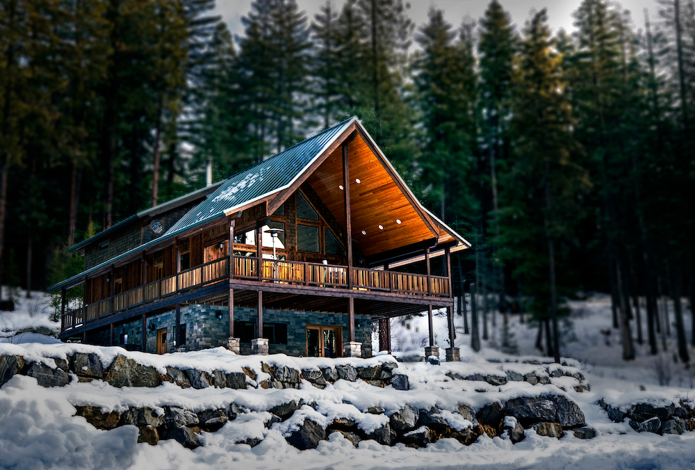 Snow Covered Log Cabin Home in the Wilderness Of the Pacific Northwest Mountains